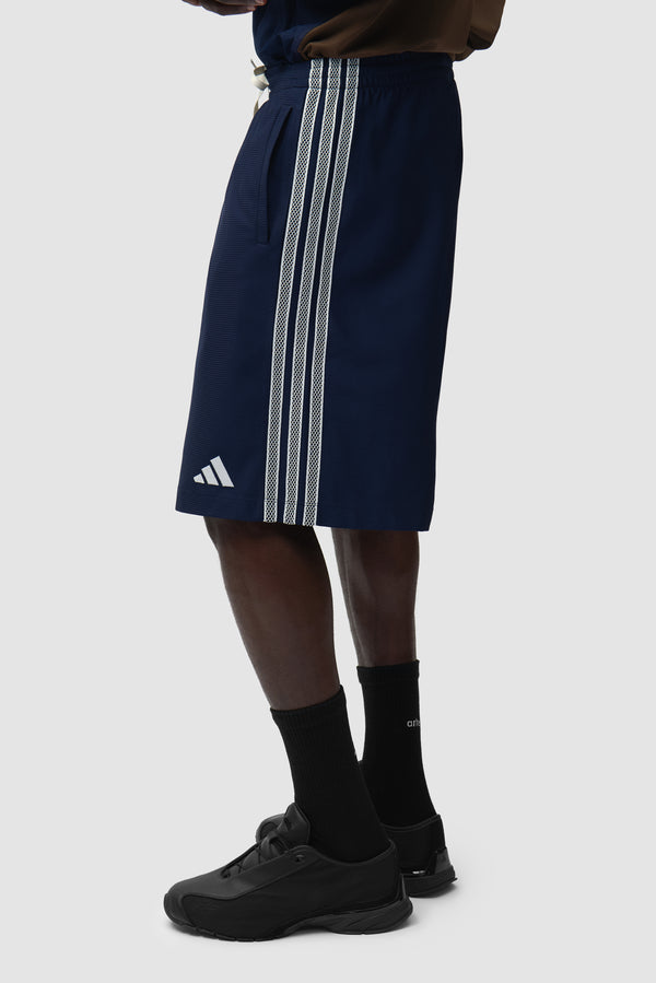 Arte for adidas Shorts in Navy worn by a model, half-body front view