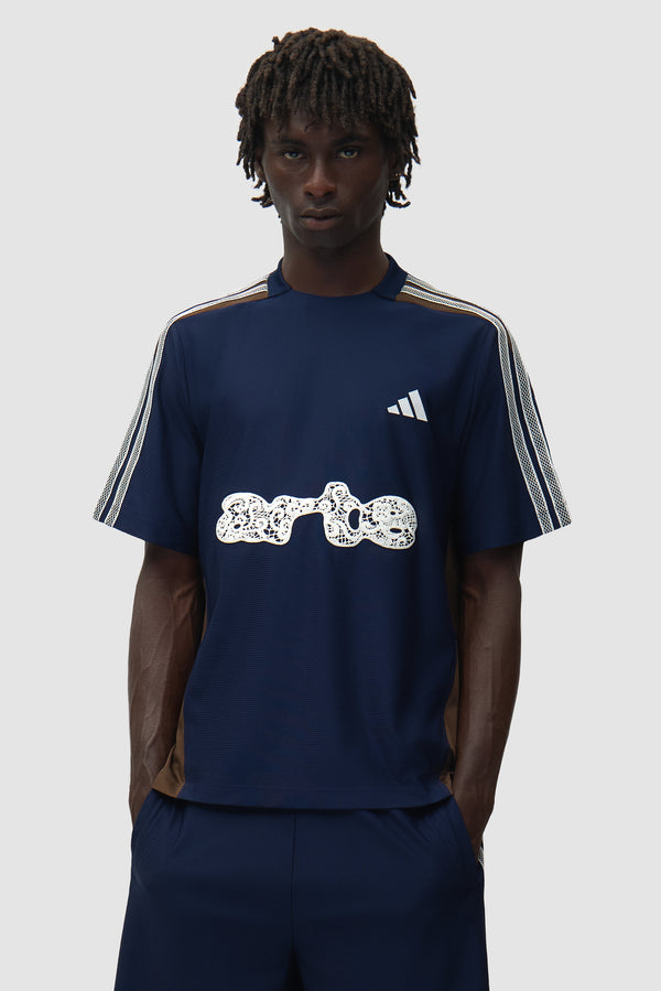 Arte for adidas Jersey in Navy/Brown worn by a model, half-body front view