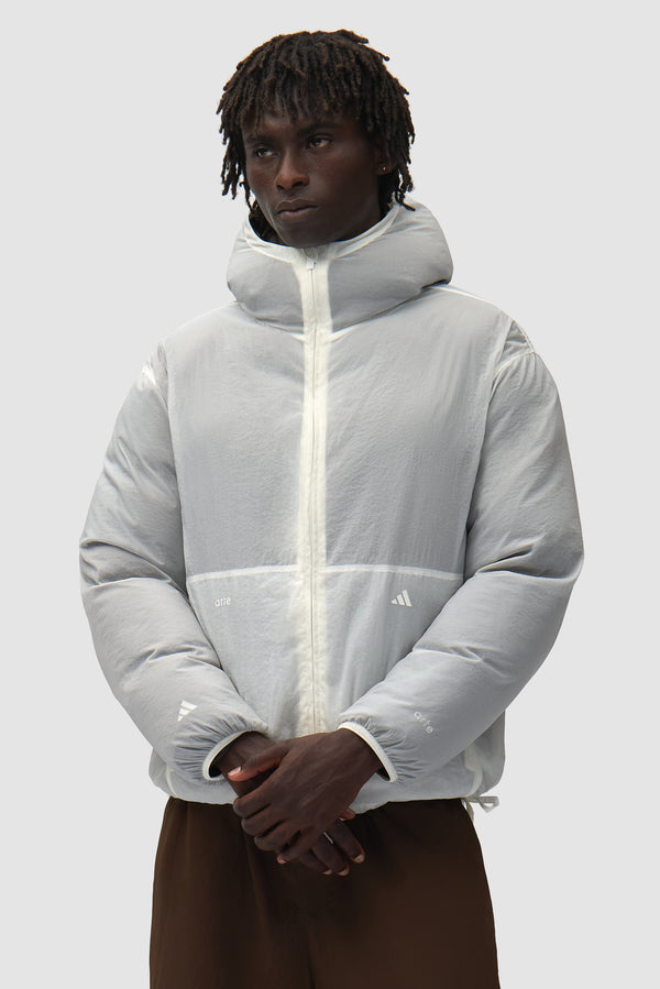 Arte for adidas Puffer in Shadow Olive worn by a model, half-body front view