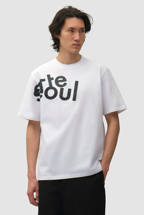 Arte/Seoul T-shirt in White worn by a model, full-body front view