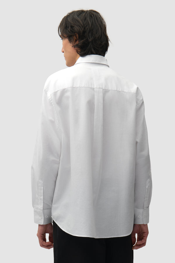Heart Gallery Shirt in White worn by a model, half-body back view