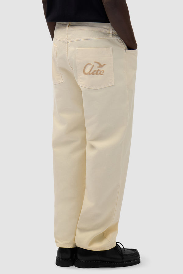 Back Bird Pants in Cream worn by a model, half-body front view
