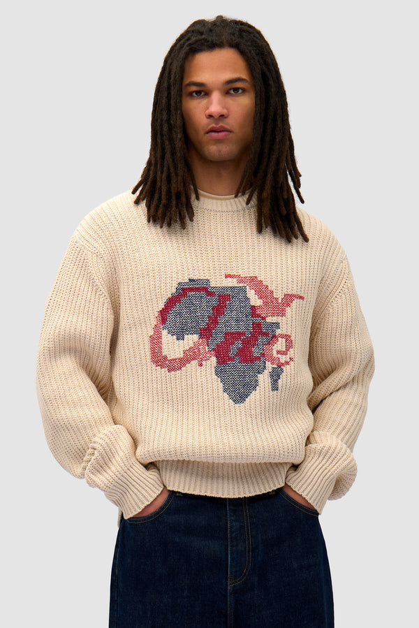 Cross Stitch Knit in Cream worn by a model, half-body front view