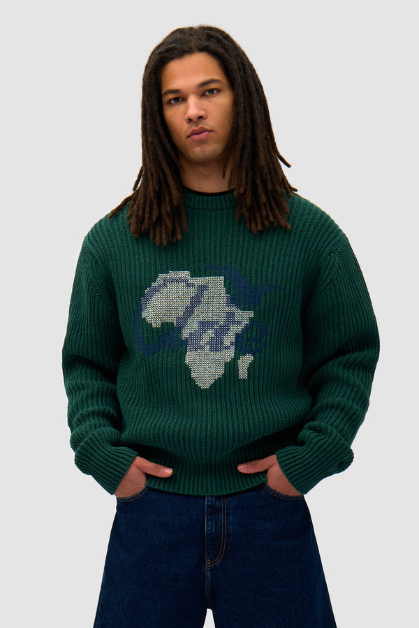 Cross Stitch Knit in Green worn by a model, half-body front view
