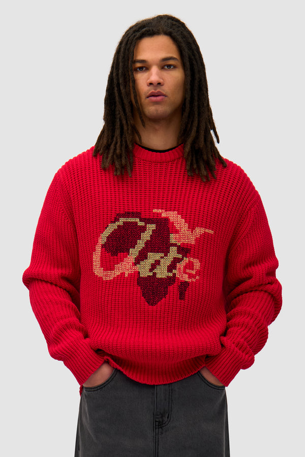 Cross Stitch Knit in Red worn by a model, half-body front view