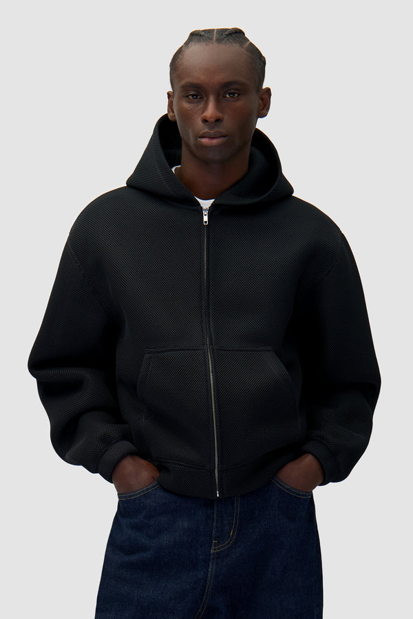 Mesh Hooded Jacket in Black worn by a model, half-body front view