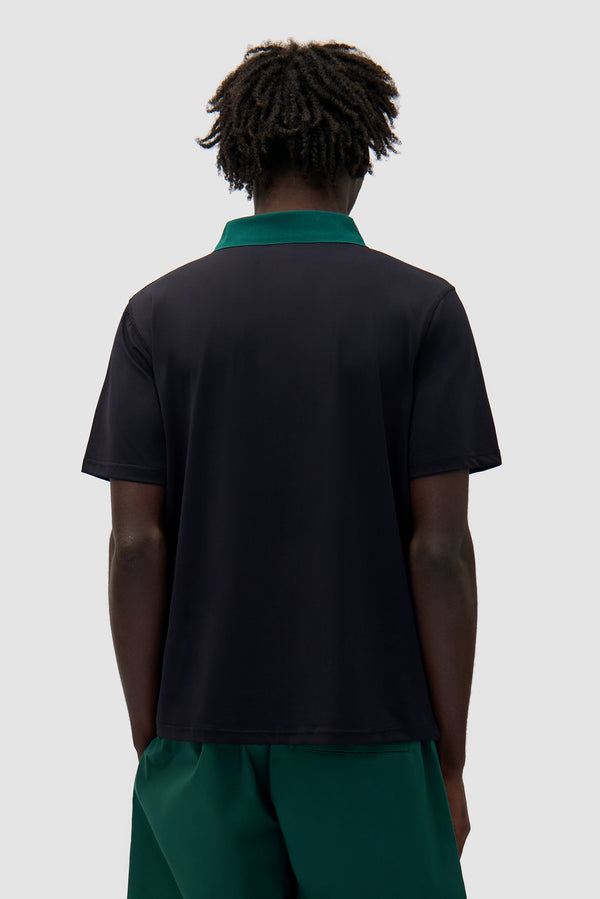 Logo Collar T-shirt in Black/Green worn by a model, half-body back view