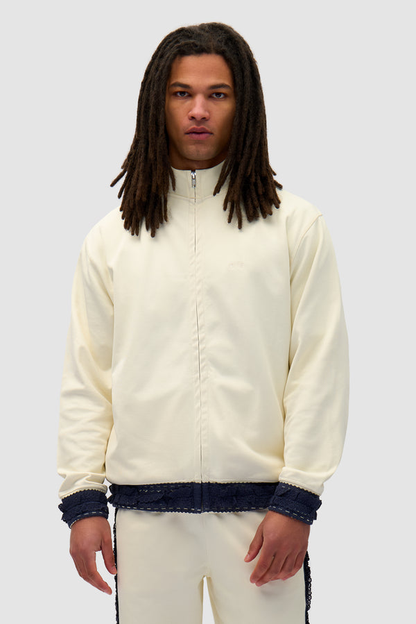 Trim Jacket in Cream worn by a model, half-body front view