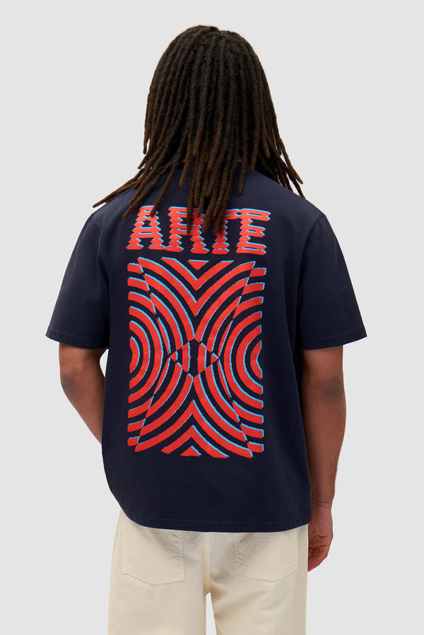 Mural Back Print T-shirt in Navy worn by a model, half-body back view