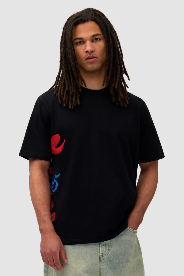 Side Print T-shirt in Black worn by a model, half-body front view