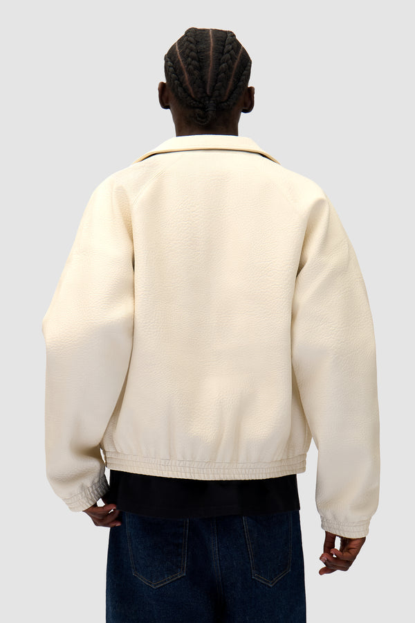 Big Logo Leather Jacket in Cream worn by a model, half-body back view