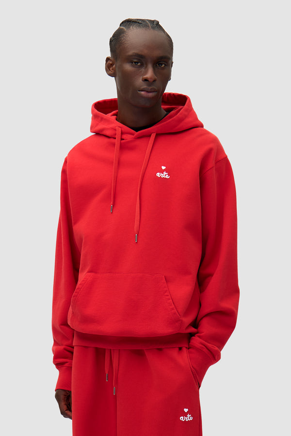 Heart Logo Hoodie in Red worn by a model, half-body front view