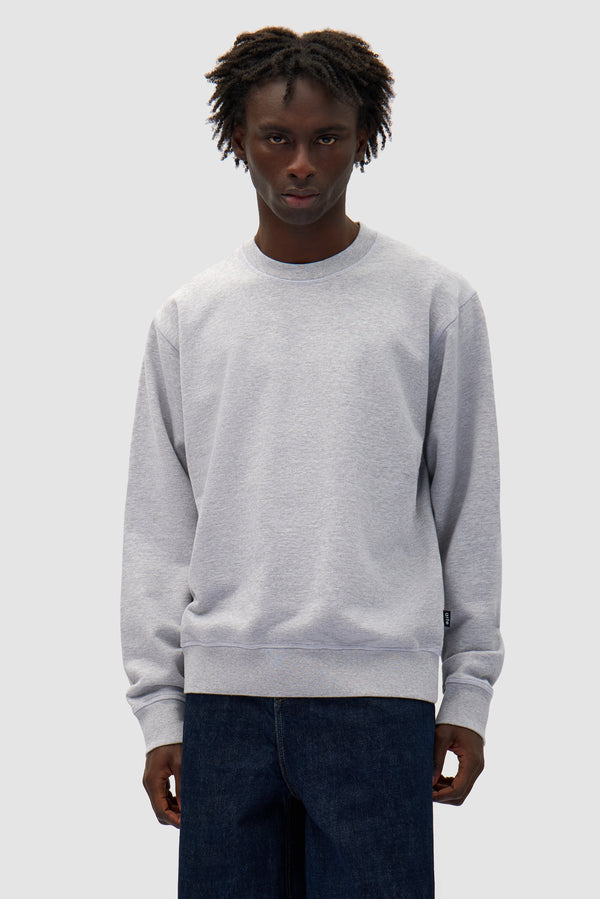 Flower Crewneck in Grey worn by a model, half-body front view