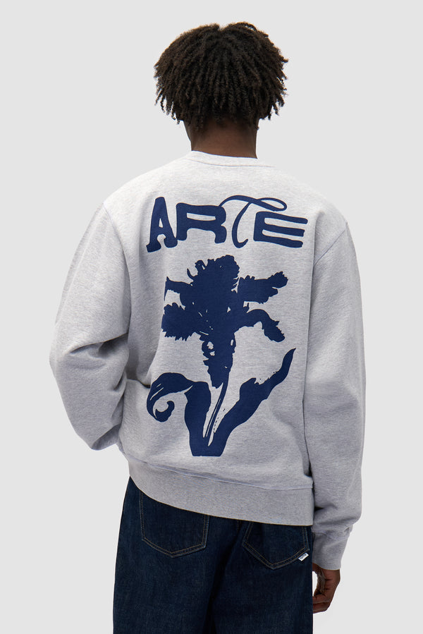 Flower Crewneck in Grey worn by a model, half-body back view