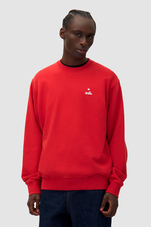 Heart Crewneck in Red worn by a model, half-body front view