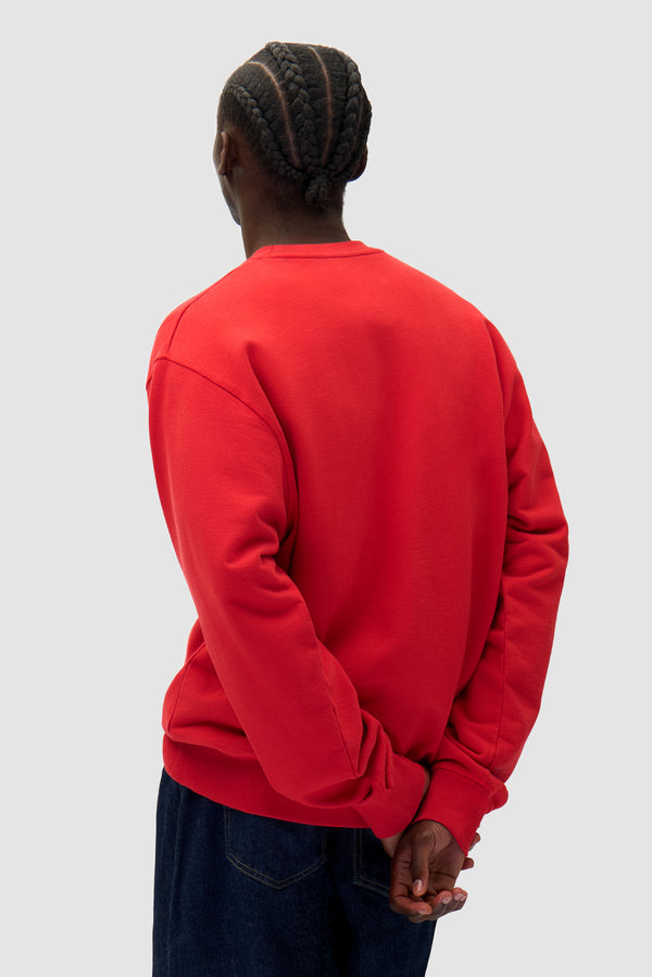 Heart Crewneck in Red worn by a model, half-body back view