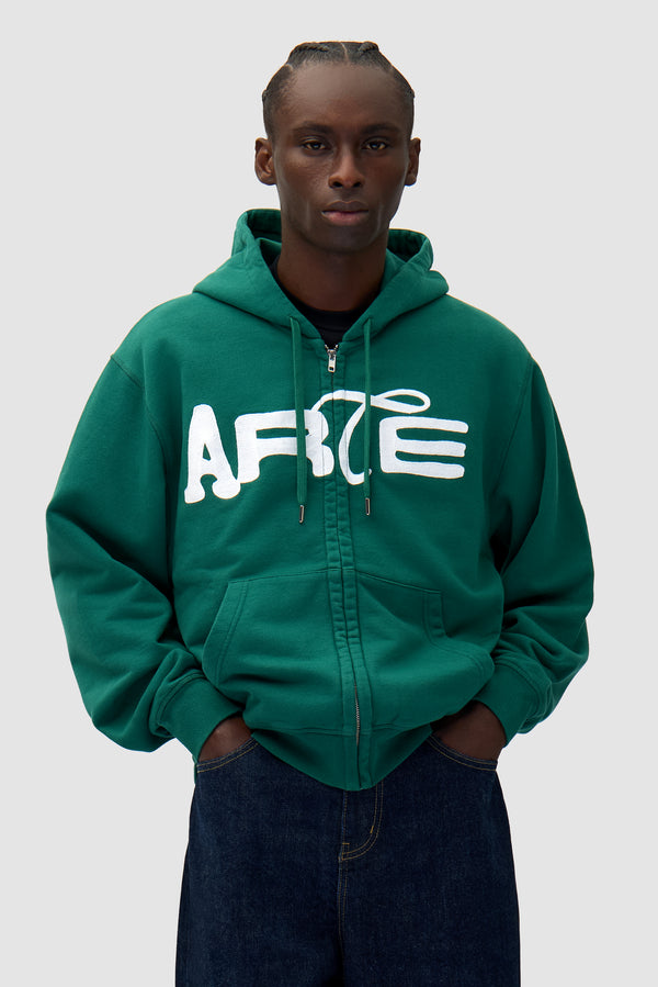 Energy Zip Hoodie in Green worn by a model, half-body front view