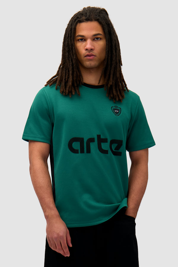 Footbal T-shirt in Green/Black worn by a model, half-body front view