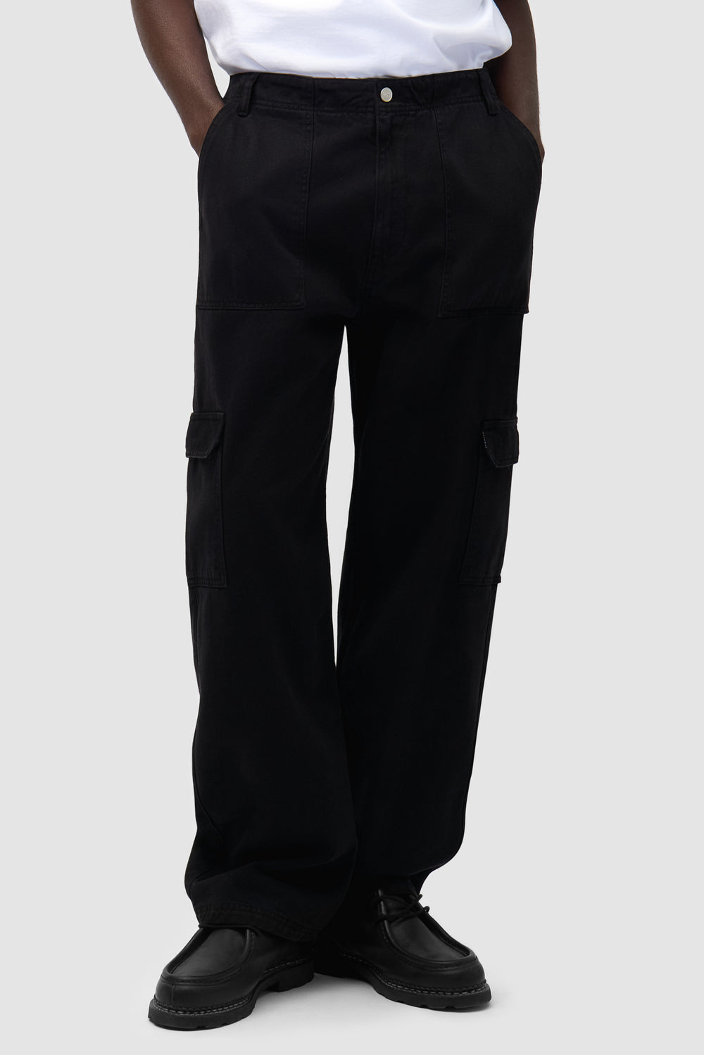 Cargo Pants in Black worn by a model, half-body front view