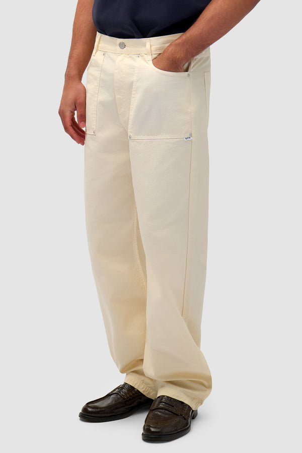 Ripstop Fabric Pants in Cream worn by a model, half-body side view