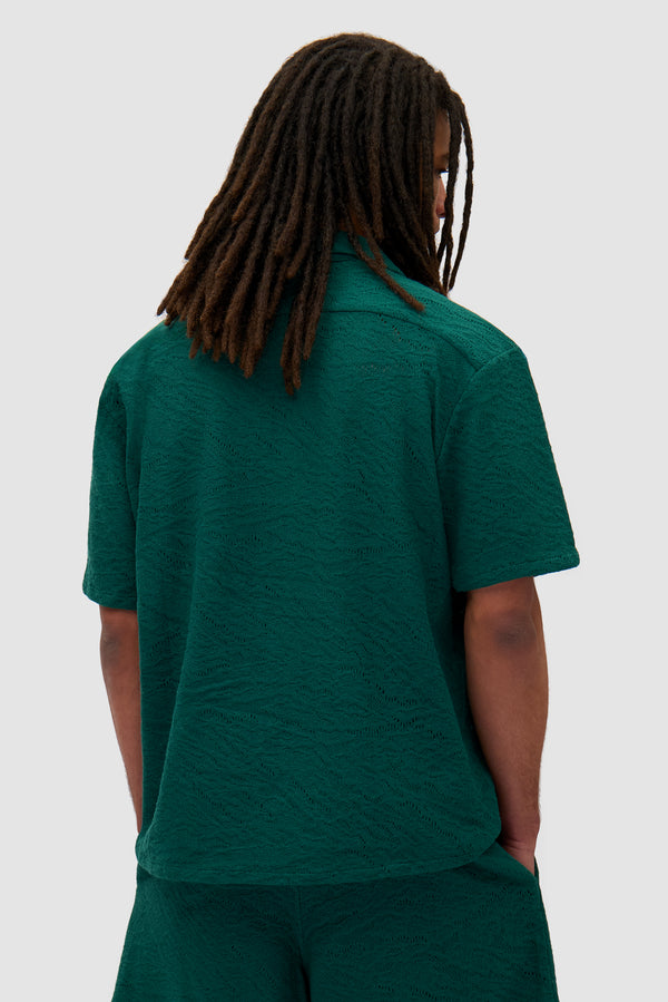 Crochet Shirt in Green worn by a model, half-body back view