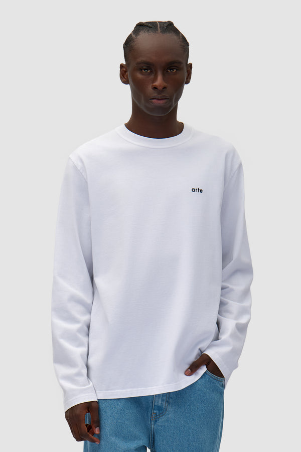 Color Print Longsleeve in White worn by a model, half-body front view