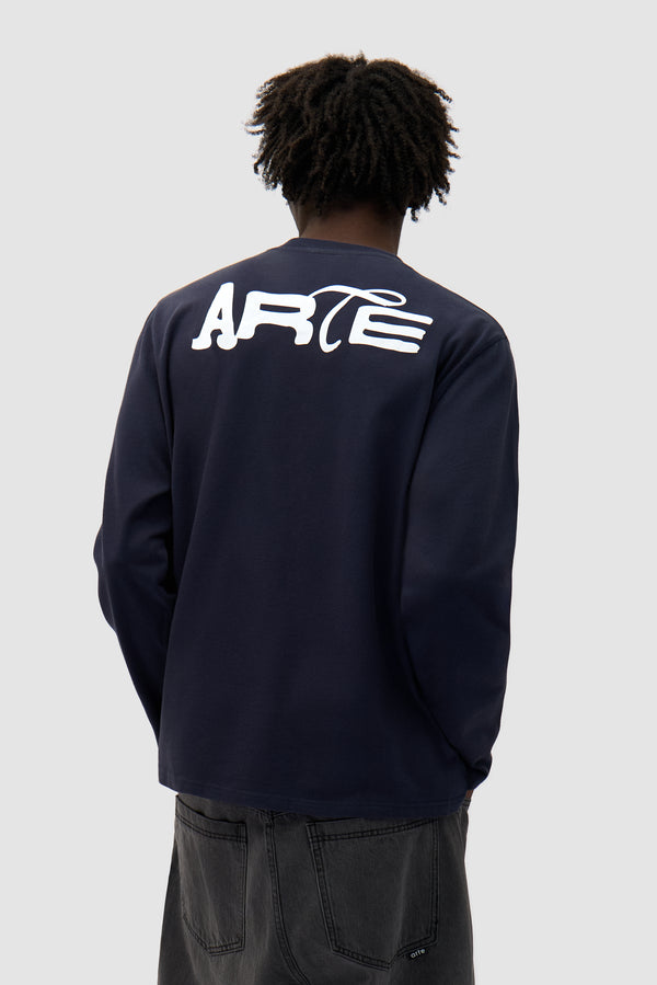 Good Energy Longsleeve in Navy worn by a model, half-body back view