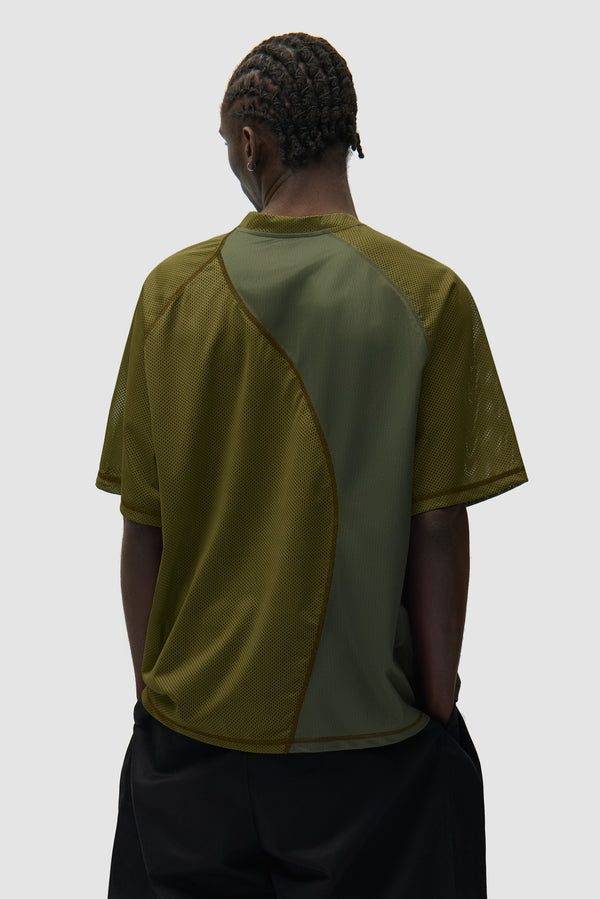 Multi Mesh T-shirt in Green worn by a model, half-body back view