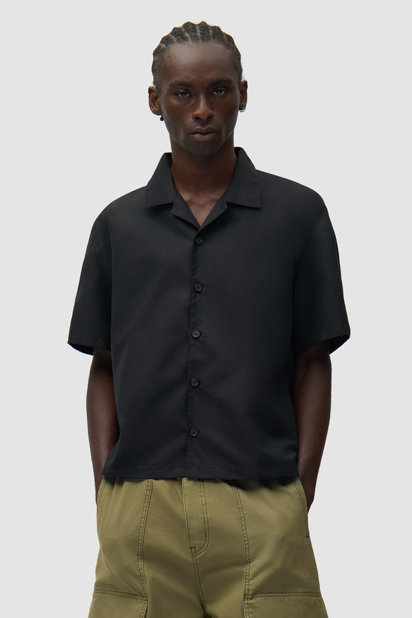 Nylon Linen Shirt in Black worn by a model, half-body back view
