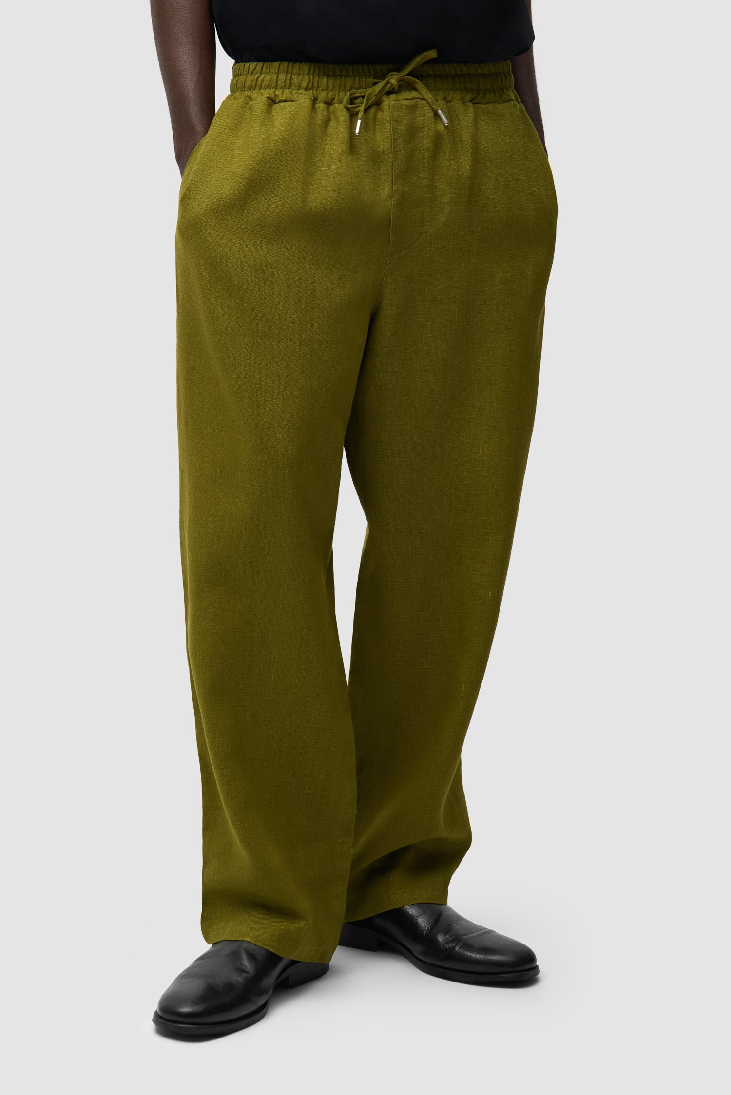 Linen Pants in Green worn by a model, half-body front view