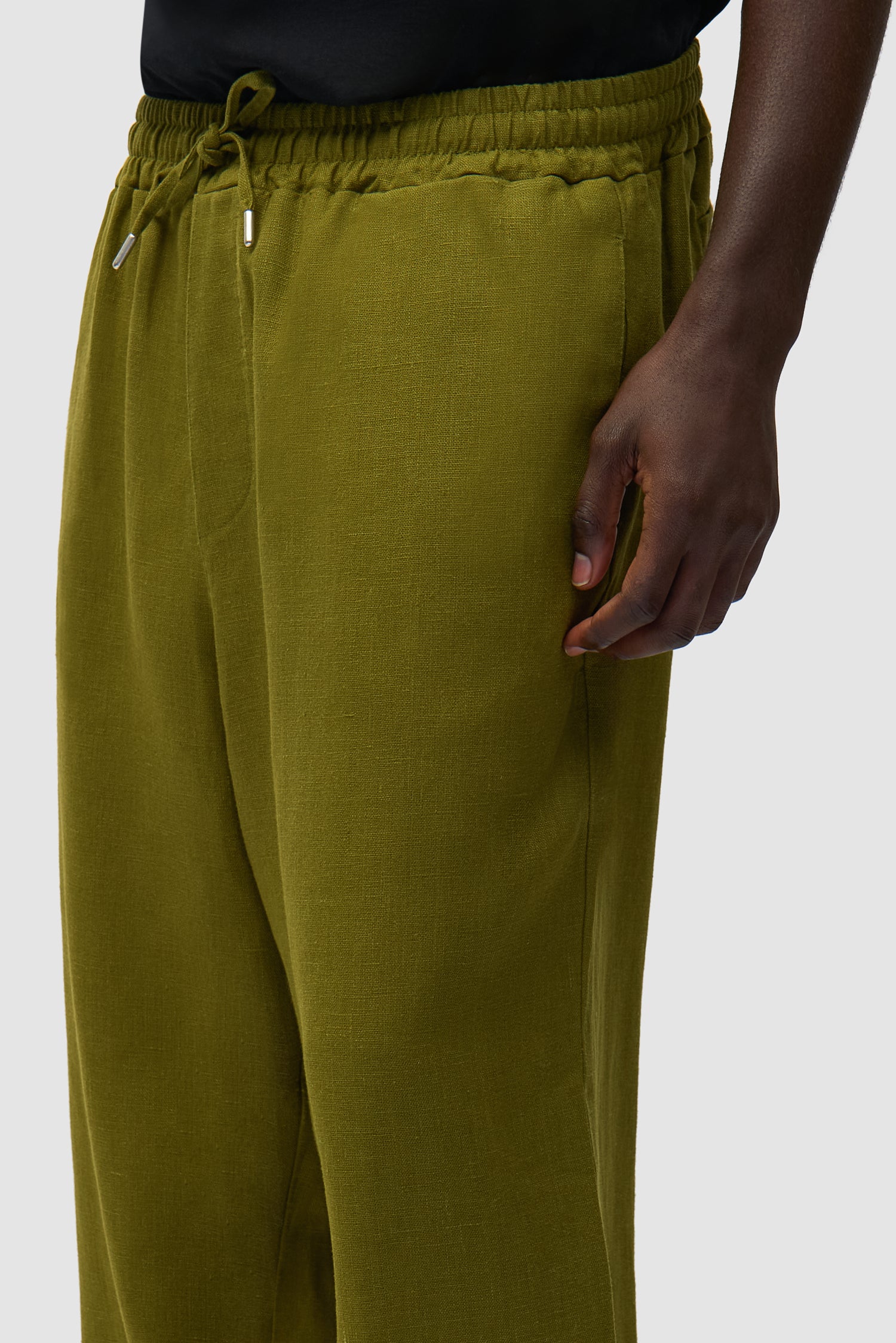 Detail view of Linen Pants in Green, showing side pockets