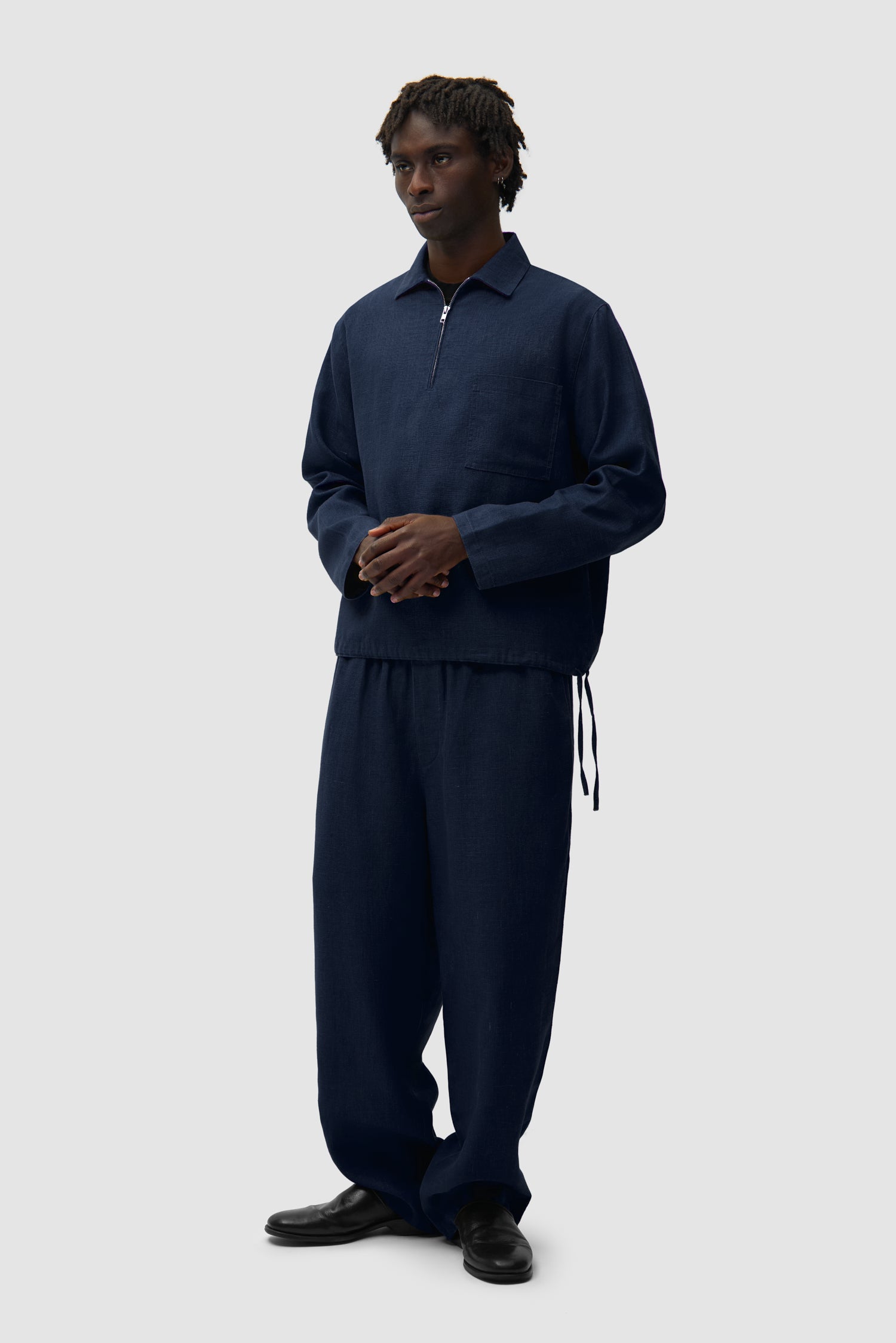Linen Pants in Navy worn by a model, full-body front view