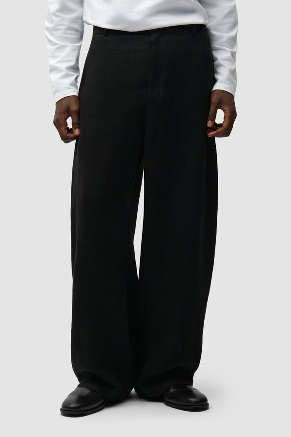 Linen Suit Pants in Black worn by a model, half-body front view