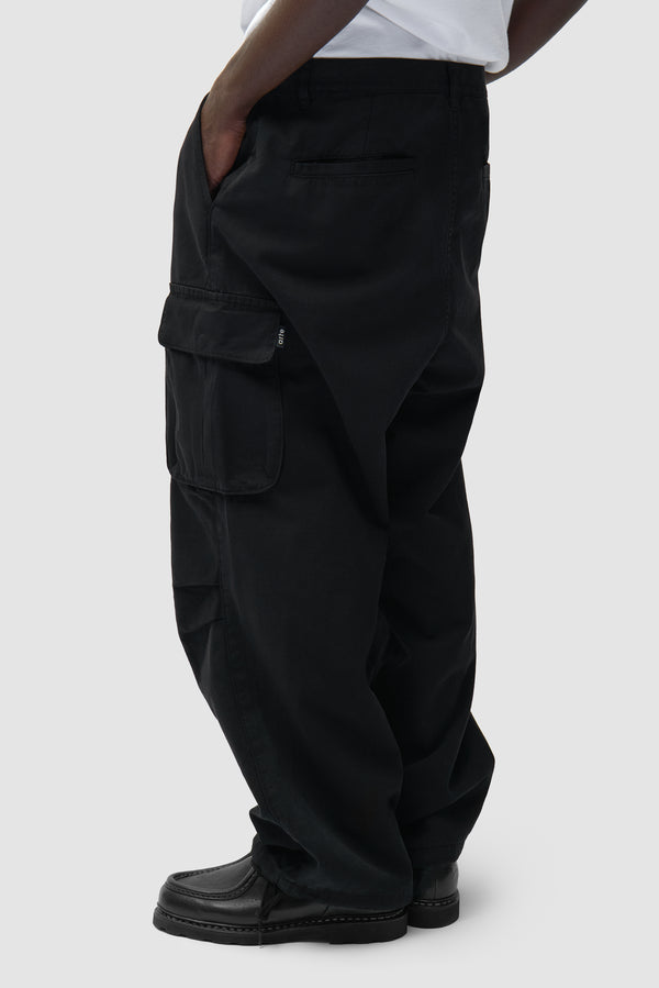 Cargo Ribstop Pants in Black worn by a model, half-body side view
