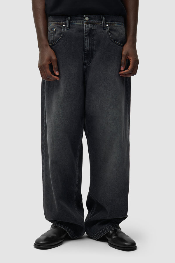 Fade Wash Baggy Pants in Black worn by a model, half-body front view