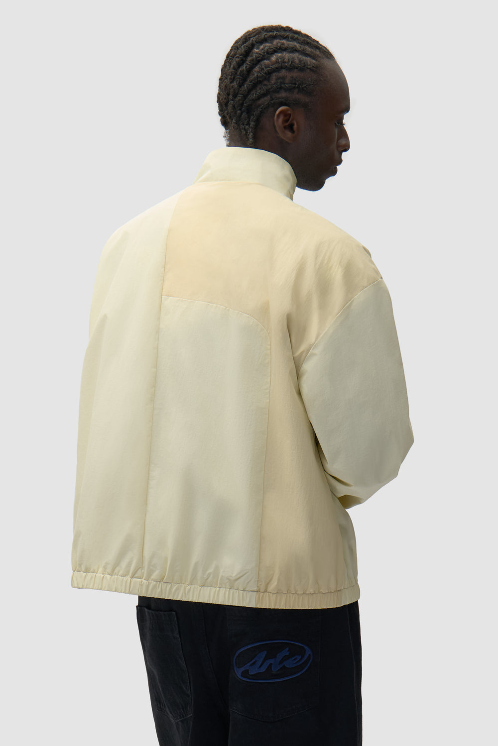 Curve Zipper Jacket in Cream worn by a model, half-body back view