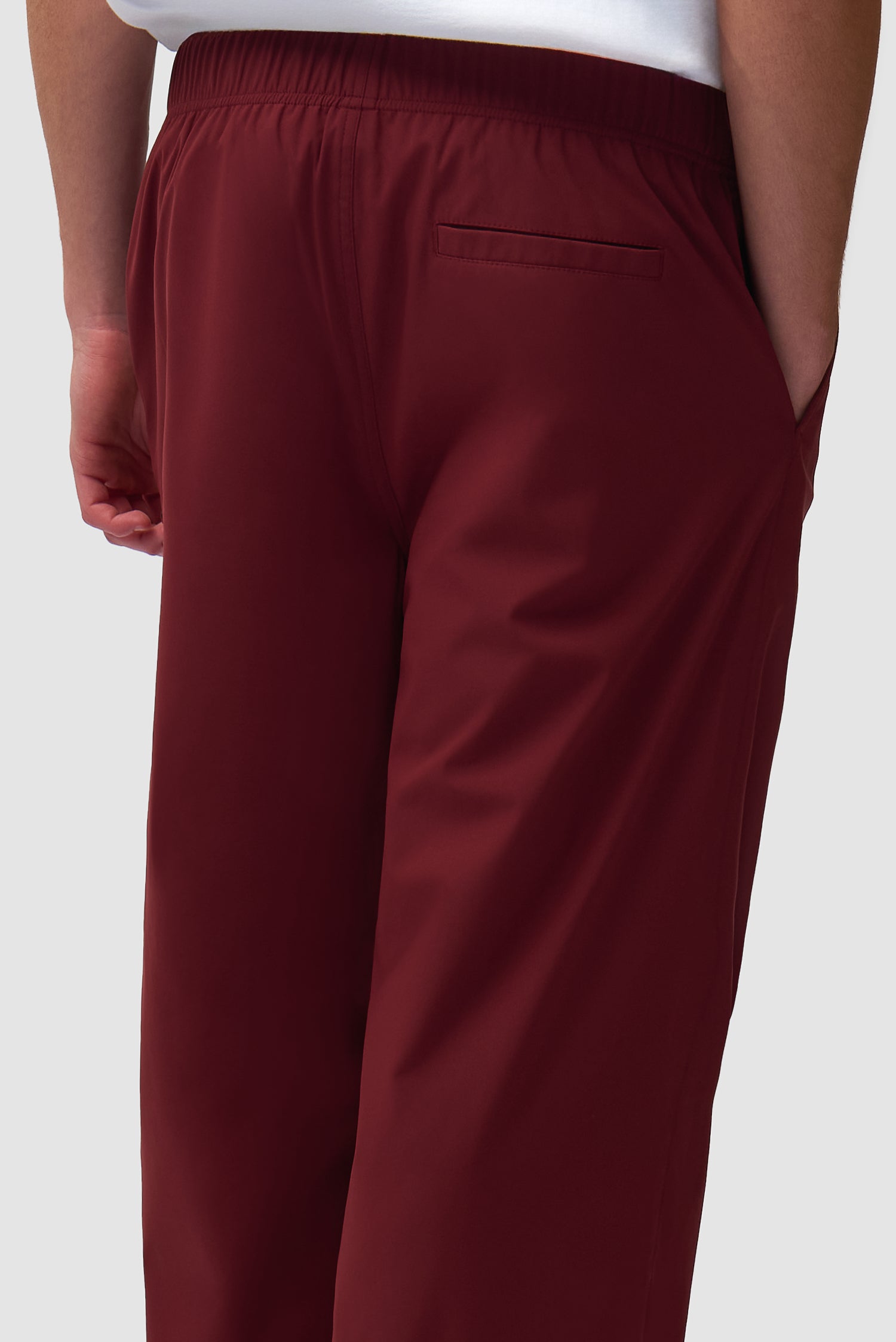 Detail view of Branded Track Pants in Bordeaux, showing back side
