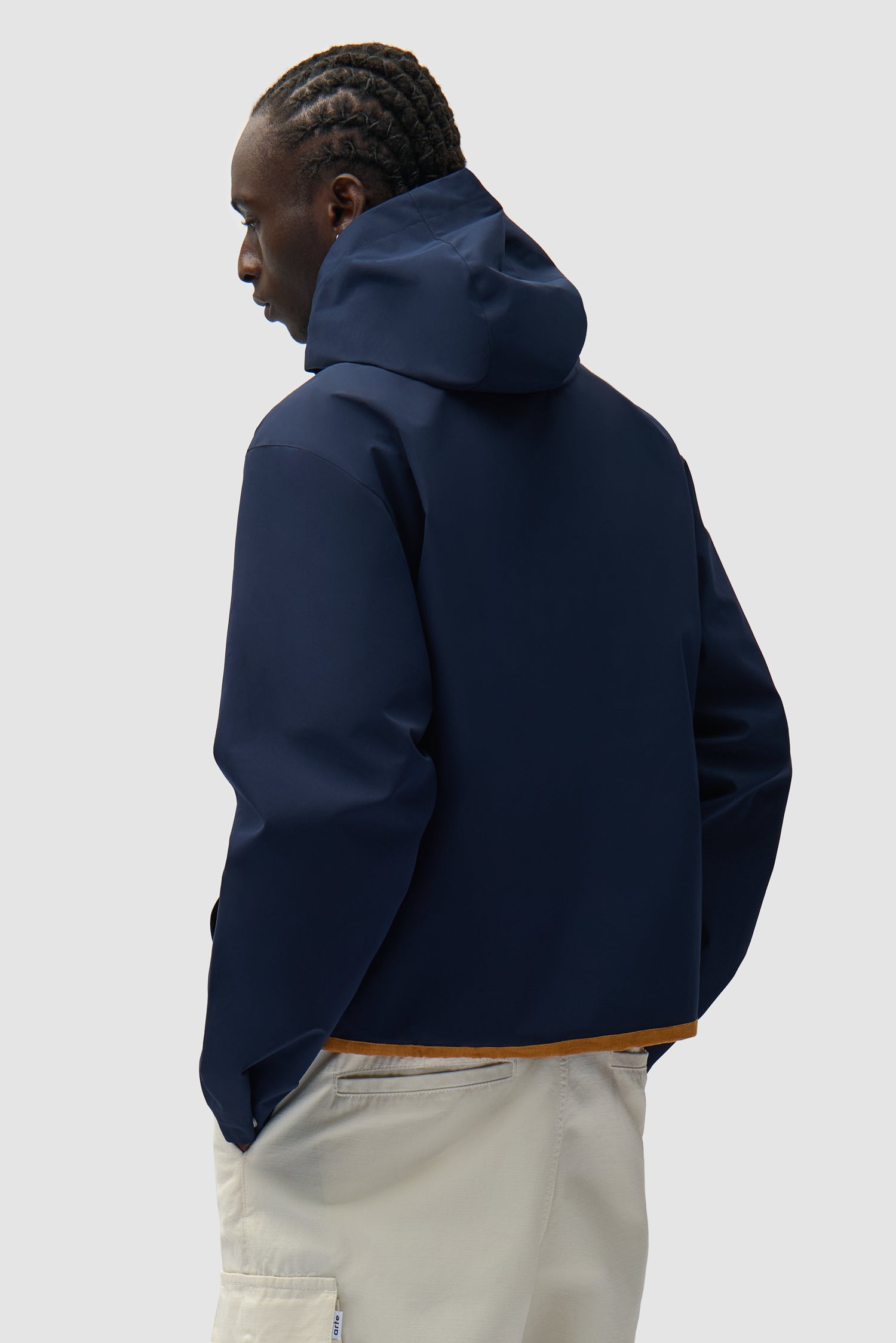 Linen Tape Hooded Jacket in Navy worn by a model, half-body back view