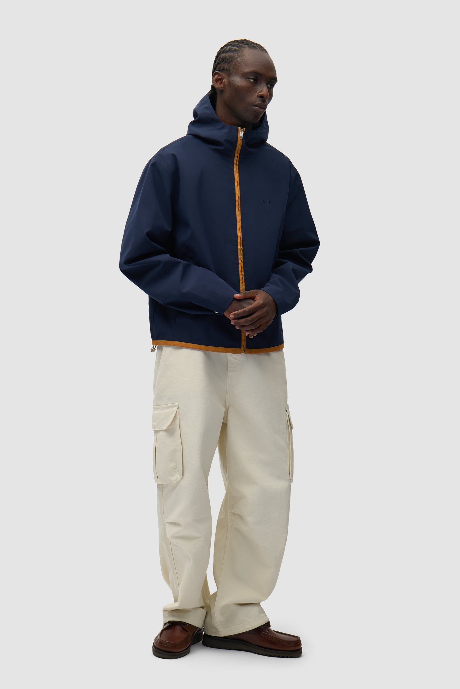 Linen Tape Hooded Jacket in Navy worn by a model, full-body side view