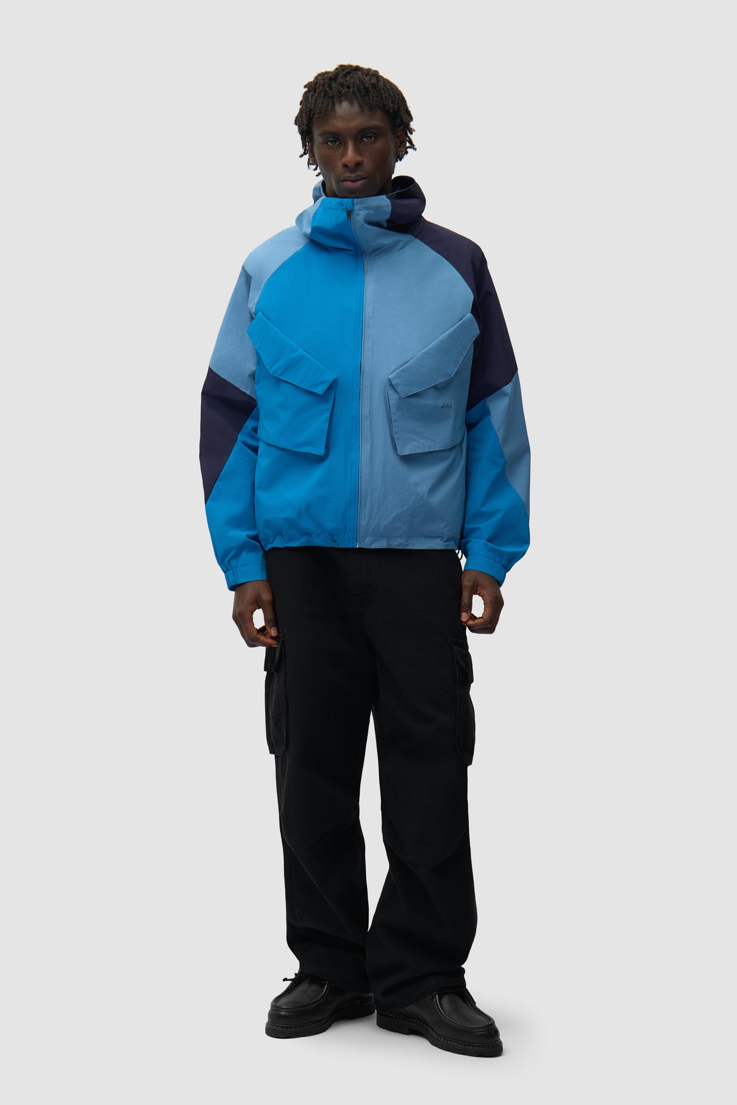 MultiColor Technical Jacket in Blue worn by a model, full-body front view