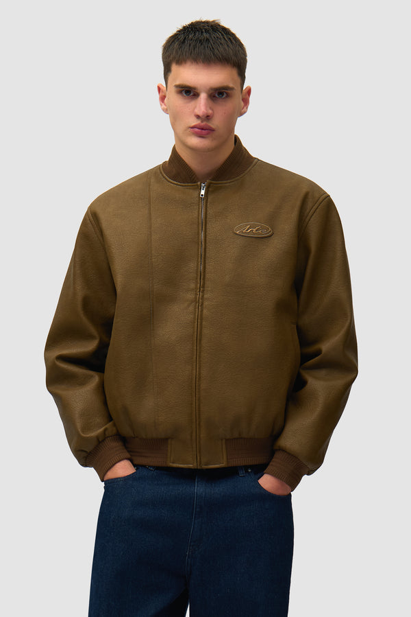 Leather Varsity Jacket in Brown worn by a model, half-body front view