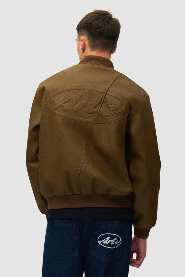Leather Varsity Jacket in Brown worn by a model, half-body back view