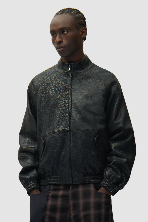 High Collar Leather Jacket in Black worn by a model, half-body front view
