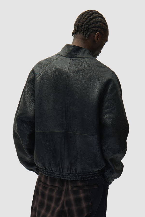 High Collar Leather Jacket in Black worn by a model, half-body back view