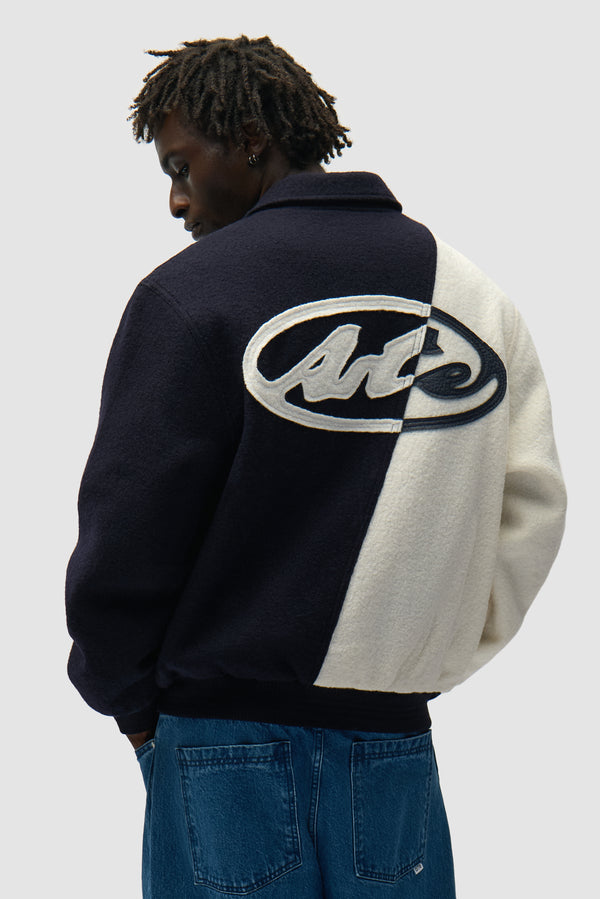 Wool Varsity Jacket in Blue/White worn by a model, half-body back view