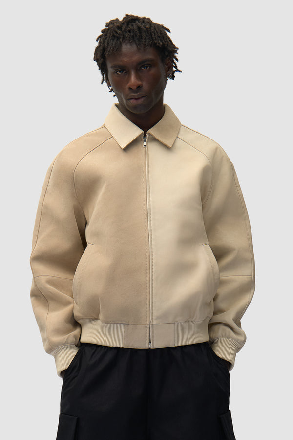 Multi Leather Jacket in Cream worn by a model, half-body back view