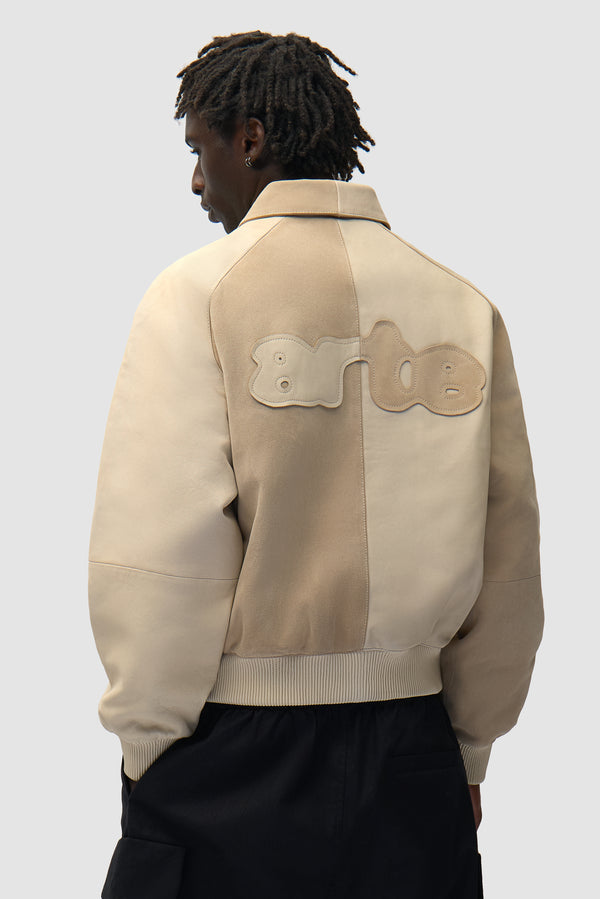 Multi Leather Jacket in Cream worn by a model, half-body front view