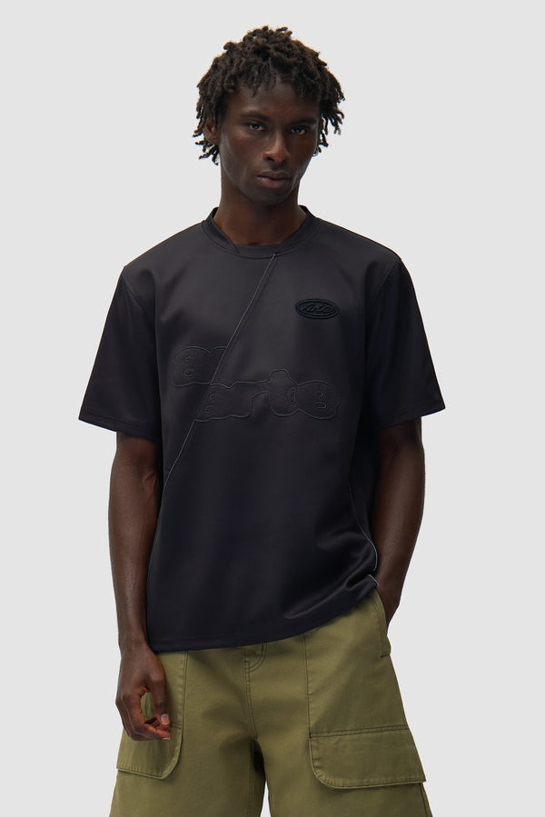 Football T-shirt in Black worn by a model, half-body front view