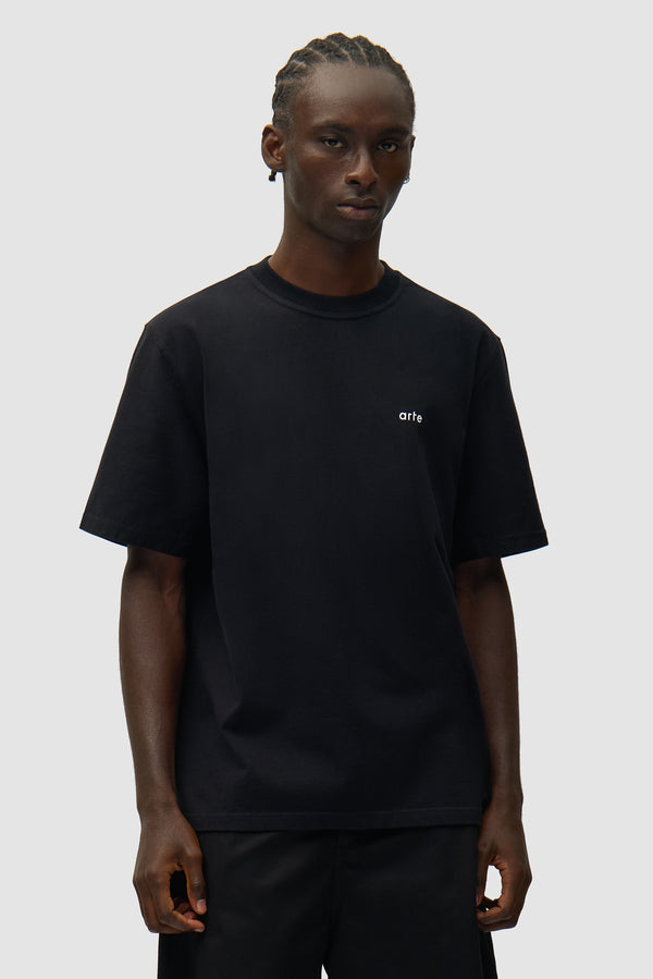 Back Poster T-shirt in Black worn by a model, half-body front view