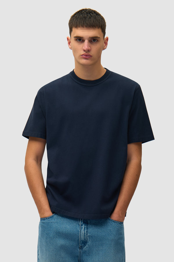 Back Collage T-shirt in Navy worn by a model, half-body front view